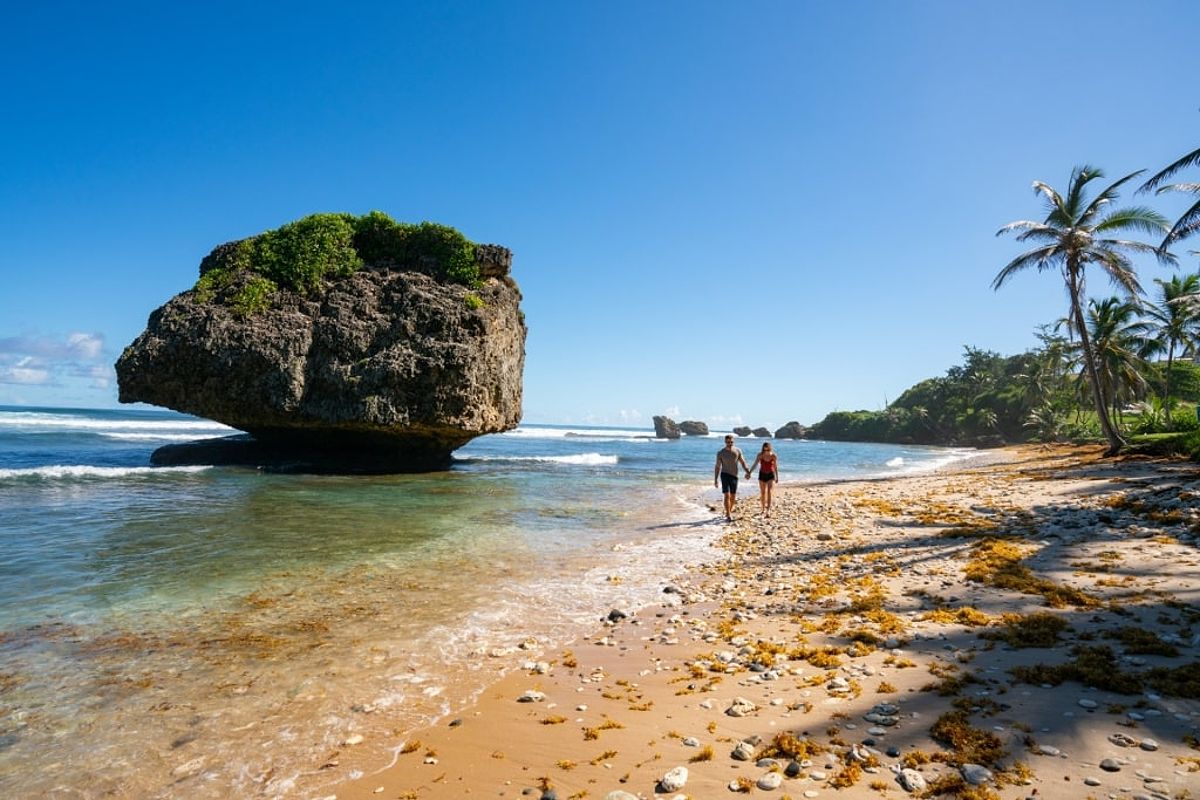 Couple strolling the Bathsheba Beach