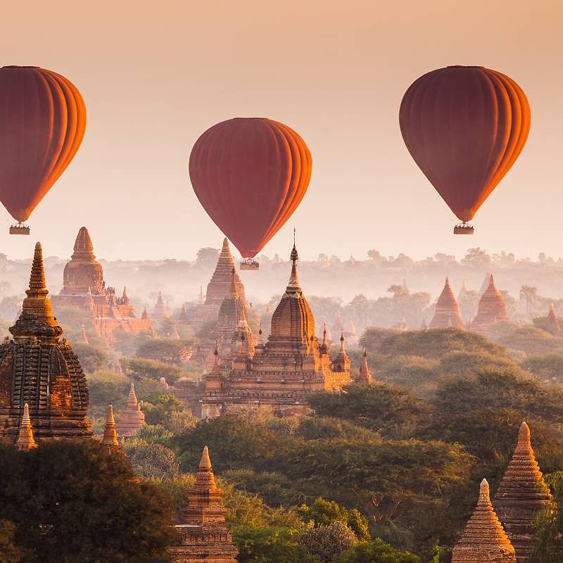 Hot air balloon over plain of Bagan at sunrise, Myanmar