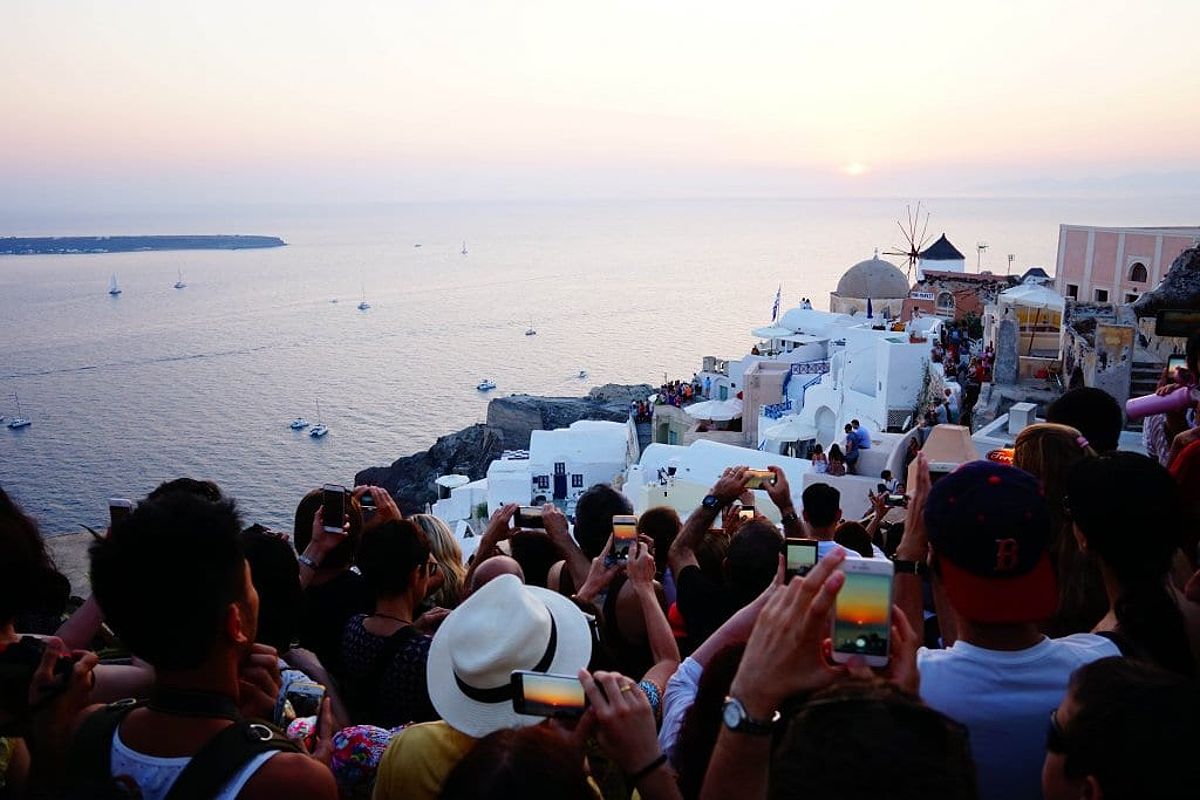 People fighting to get sunset picture in Santorini